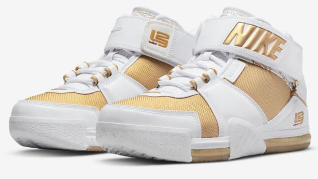 View of LeBron James' white and gold Nike shoes.